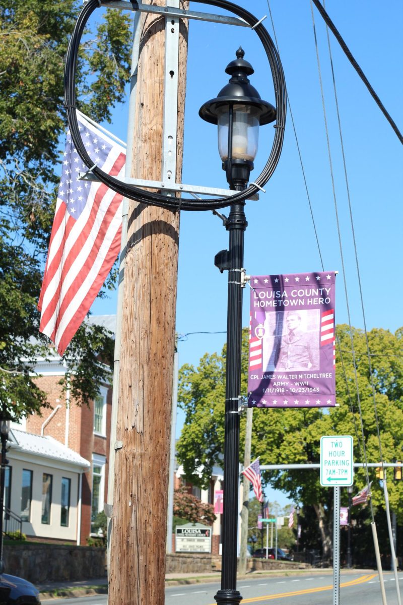 The town of Louisa honors fellow soldiers and heroes as they hang banners around town.