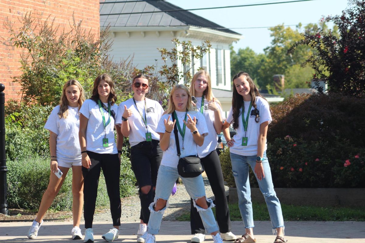 On their way to an Interview, a group of staffers pose for a photo.