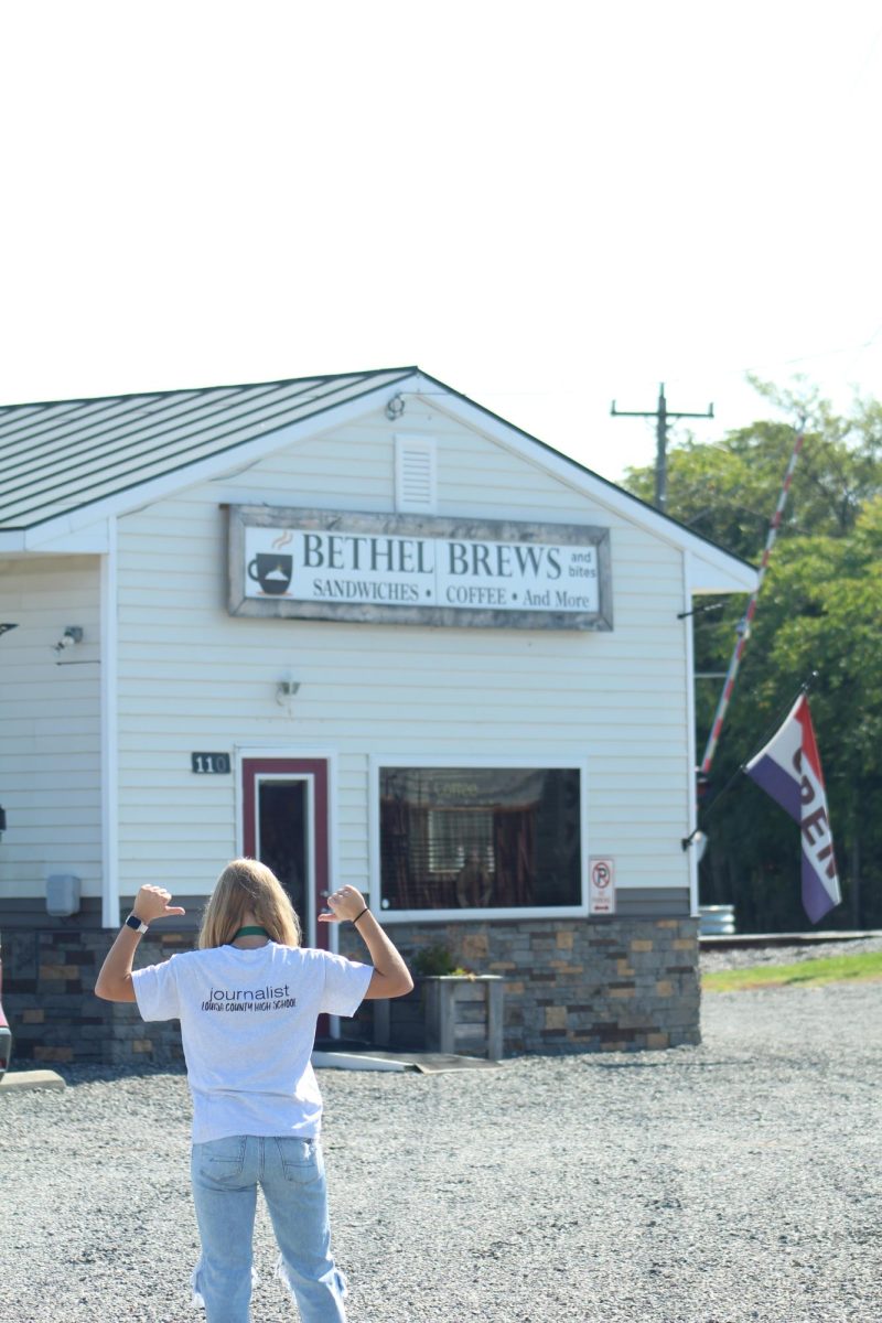 As Elizabeth Middlesworth heads to Bethel Brews and Bites, she poses for a photo.