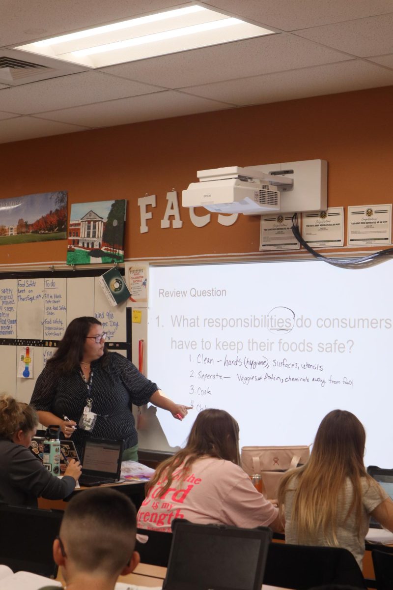 FCCLA advisor Ms. Lohr teaches in her classroom.