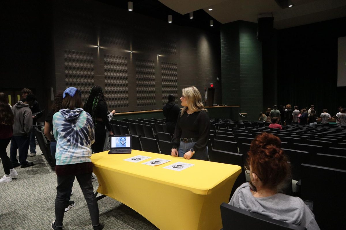 Kasey Goldschmidt stands awaiting to tell students about her running for class treasurer