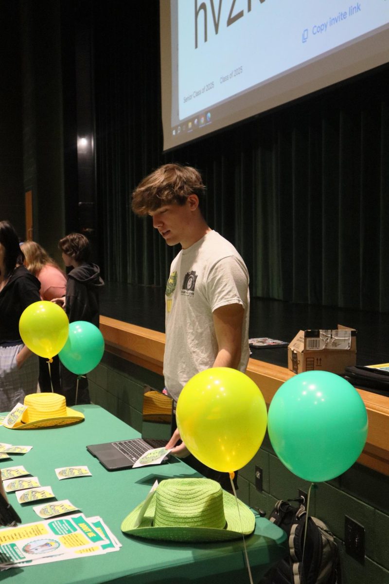 Colby Davis talks to other seniors about his running for class president 