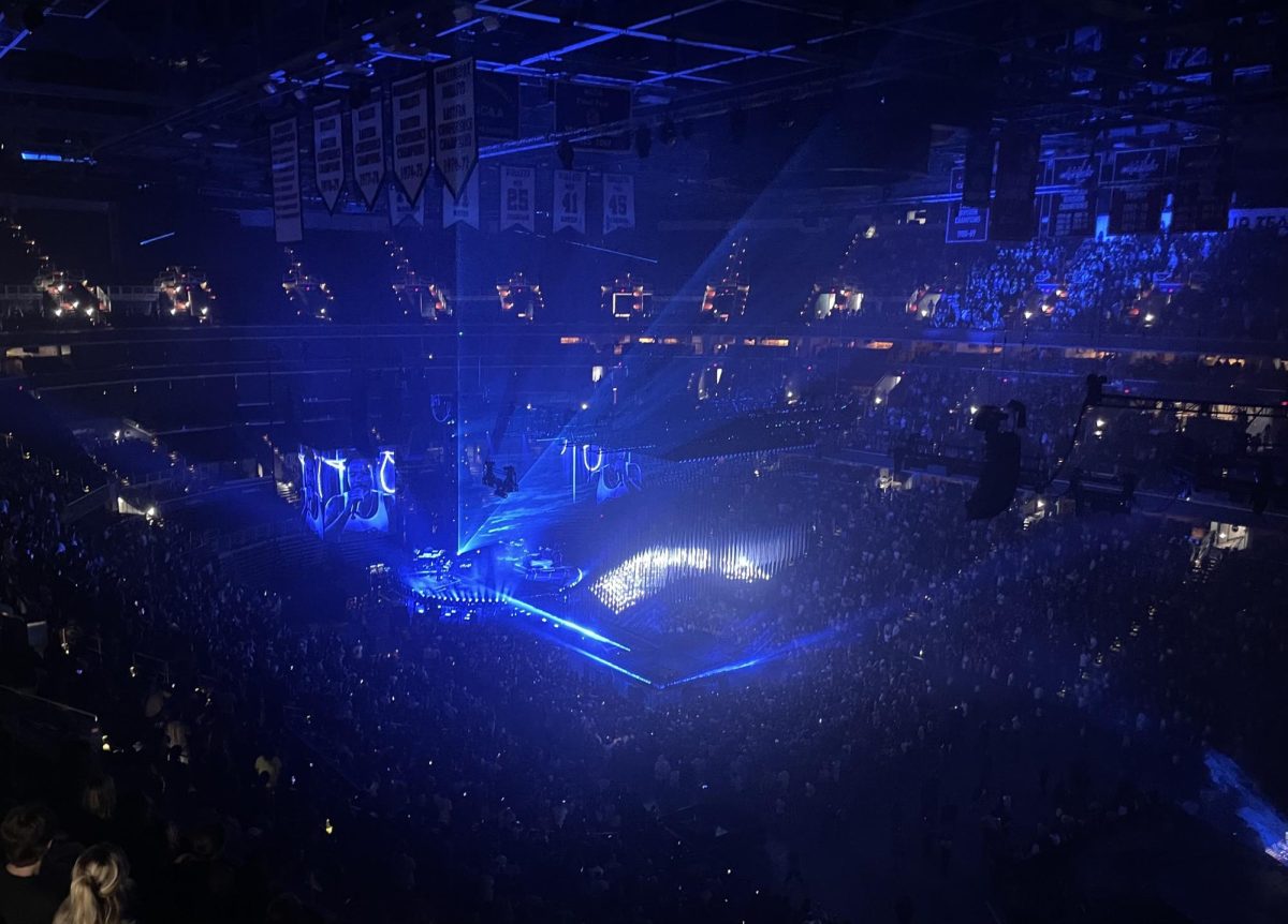 Childish Gambino moves backstage as the band plays during the intermission. 