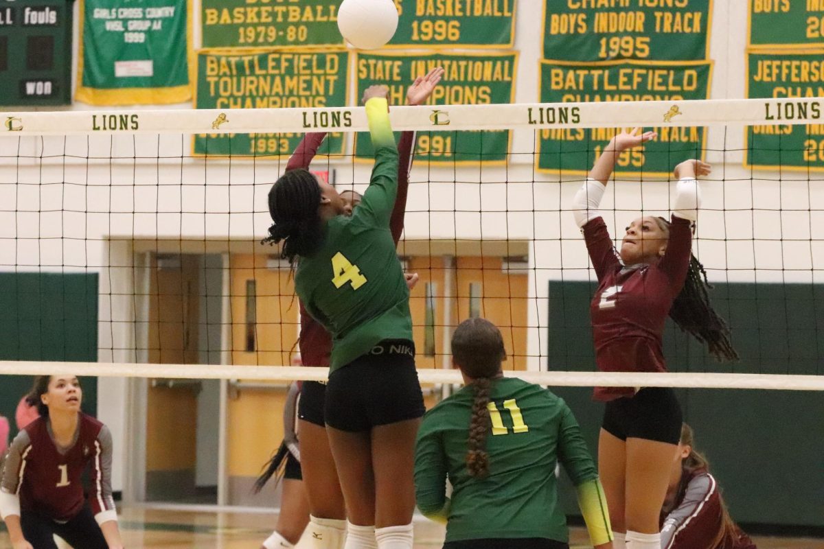 Captain Isabella Williams spikes the ball back over the net. 