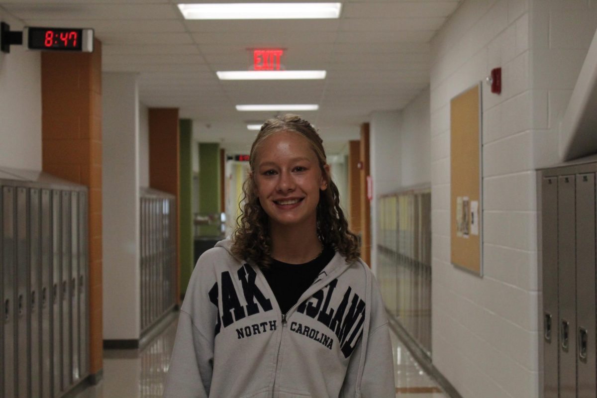 Freshman Avery Mullen poses for a photo in the hallway.