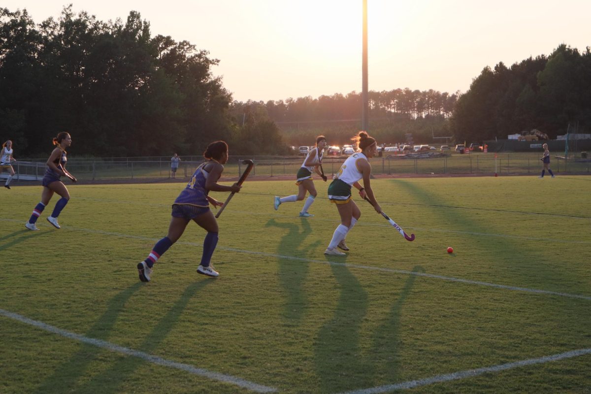 Junior Lauren Goodman brings the ball down the field towards the goal against King George.
