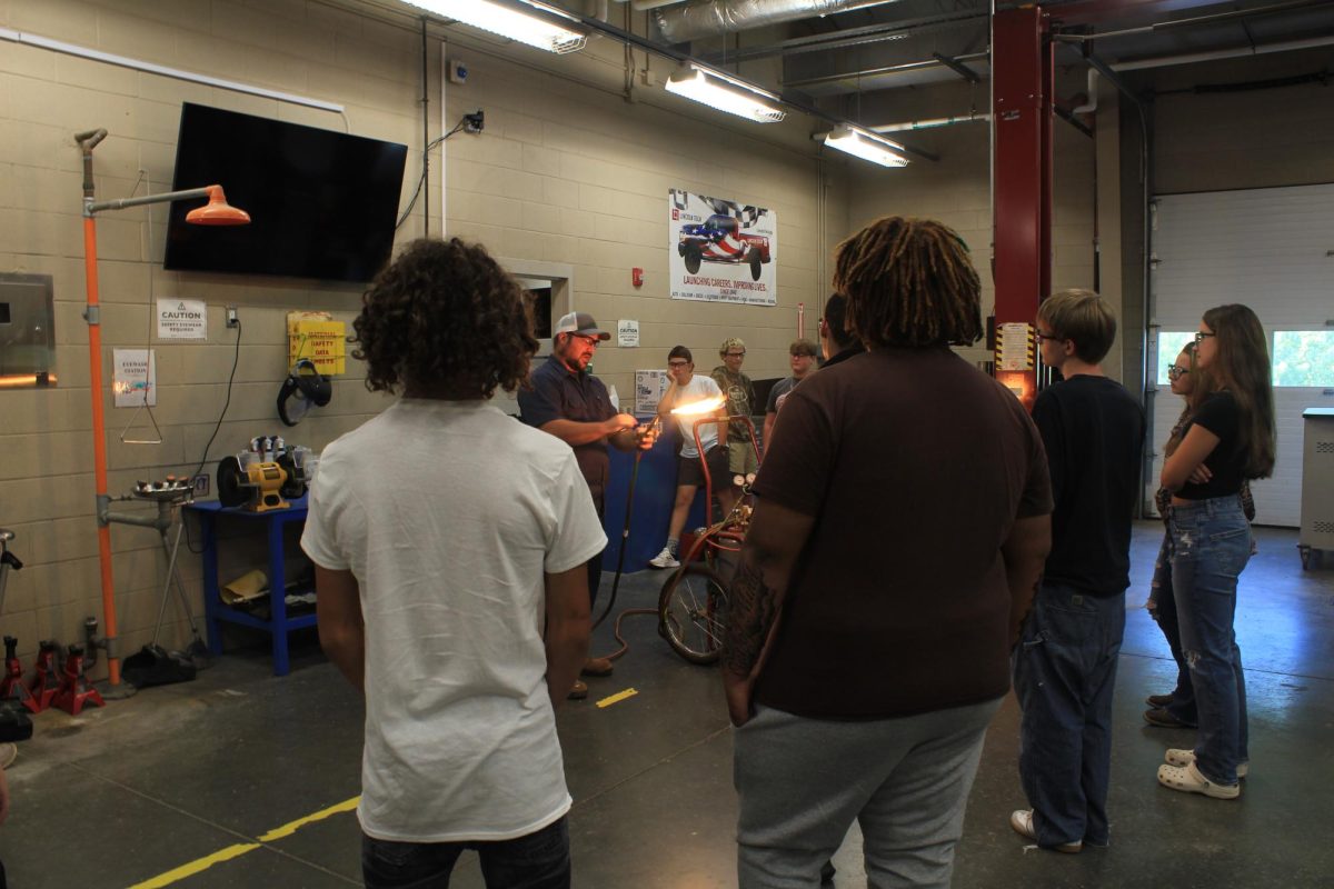 Mr. Galanti teaches his Auto 1 students how to use a torch. 