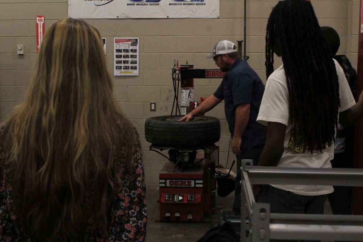 Mr. Galanti teaches his Auto 1 students how to use a tire machine, this machine is used to remove and replace tires from the rim. 
