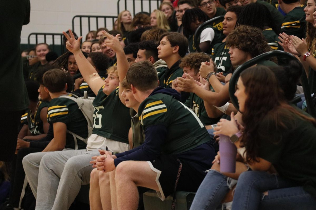 Senior Braden McIntire gets hyped during a pep rally game before the football game.