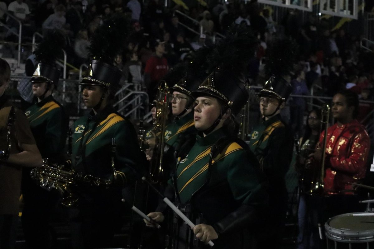 The band makes their way off the field after their performance of the National Anthem.