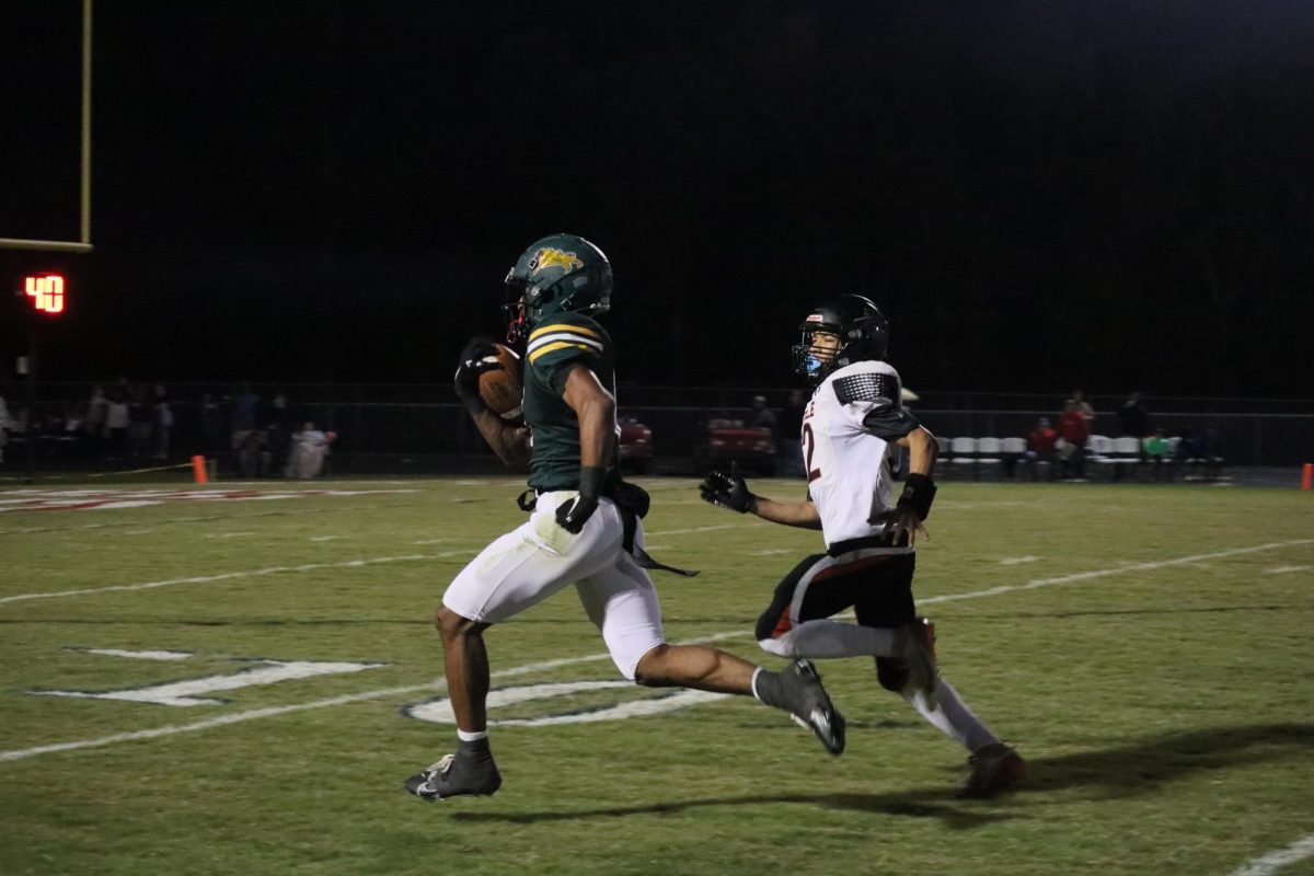 Wide receiver, Dyzier Carter runs to the end zone in order to score a touchdown, putting Louisa ahead.