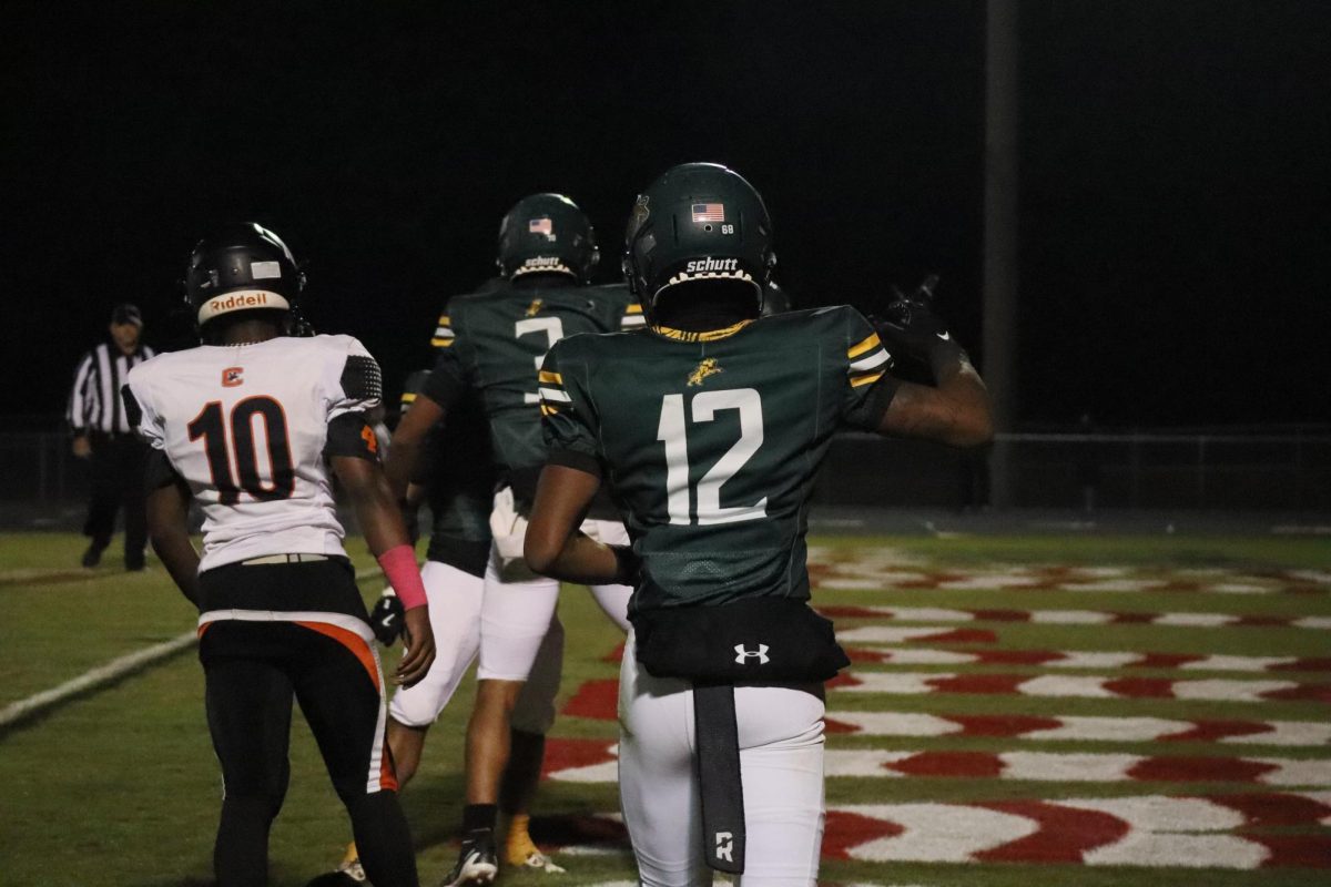 Junior Dyzier Carter celebrates after a touchdown by his teammates.