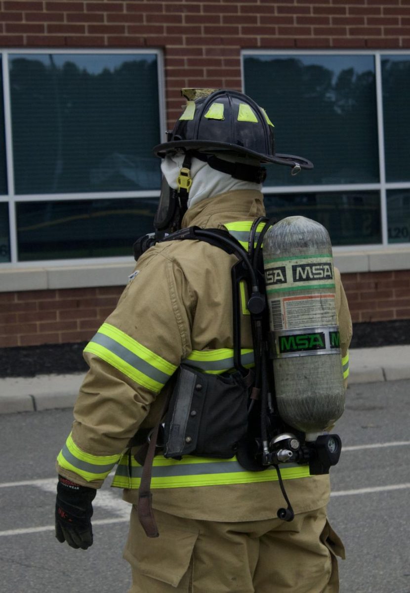 Hamm checks his students' effectiveness of securing his oxygen tank. 