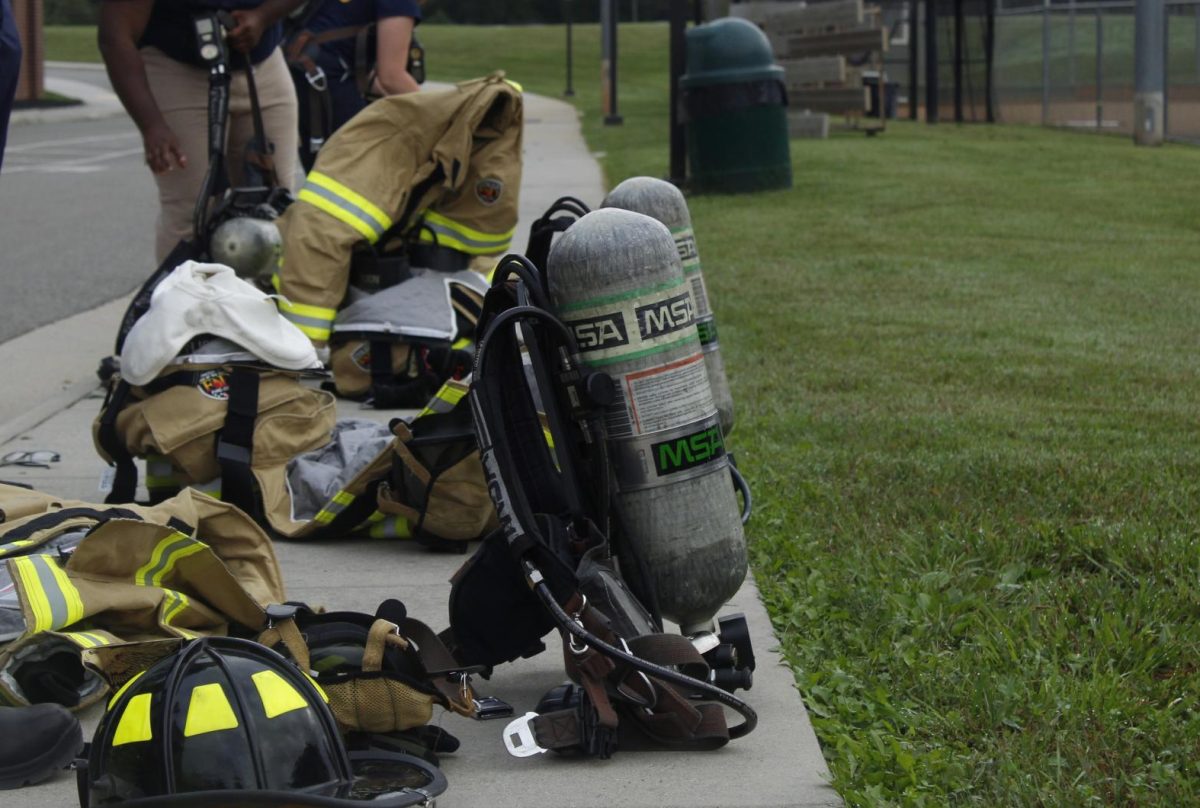 Students of the Fire and Ems class run through a dressing drill to work on their time to get ready.