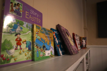 Common children’s books sit on the shelves of Flower Child Consignment for another young child to pick them up.