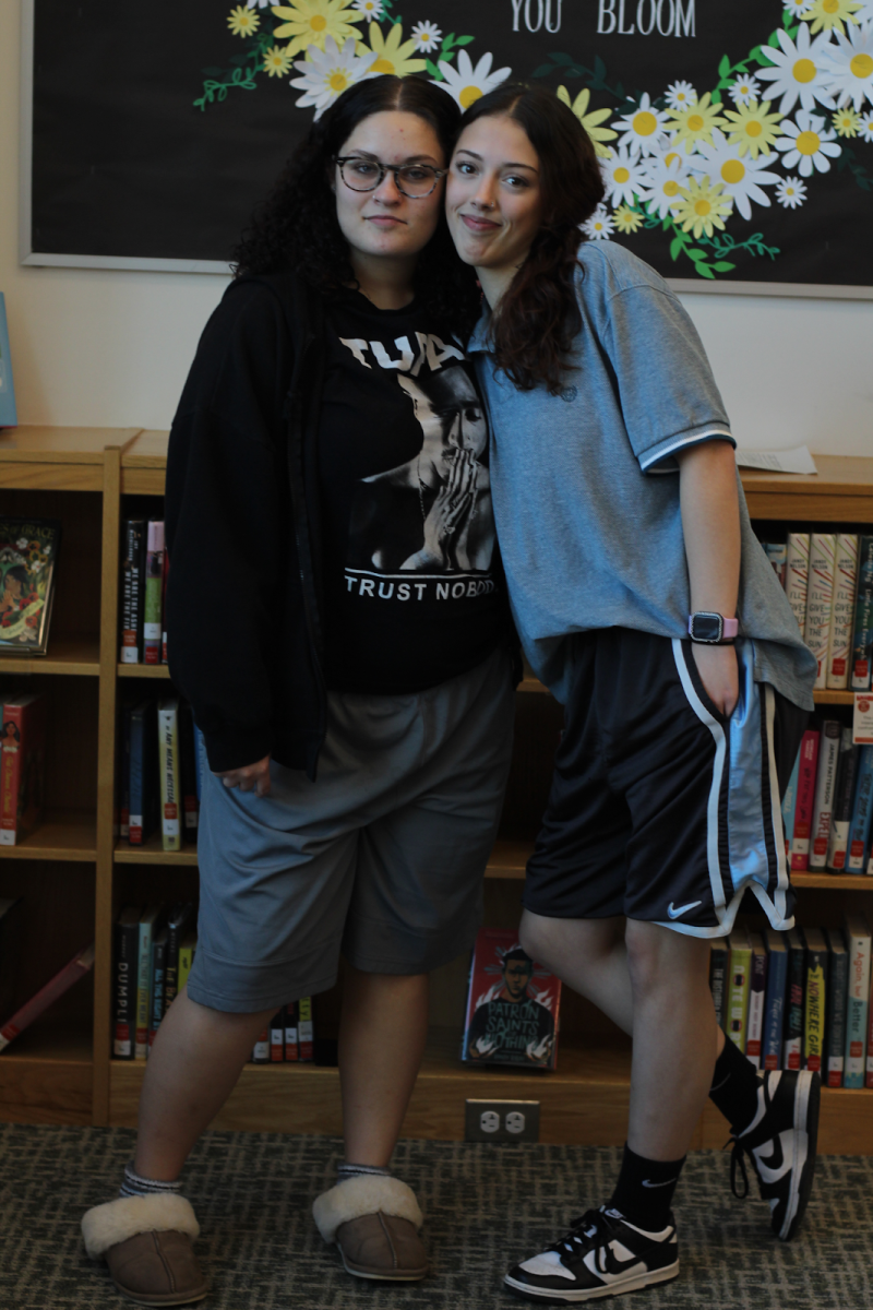 Juniors Elizabeth Babich (left) and Alyssa Rigg (right) pose together in Adam Sandler-inspired outfits.
