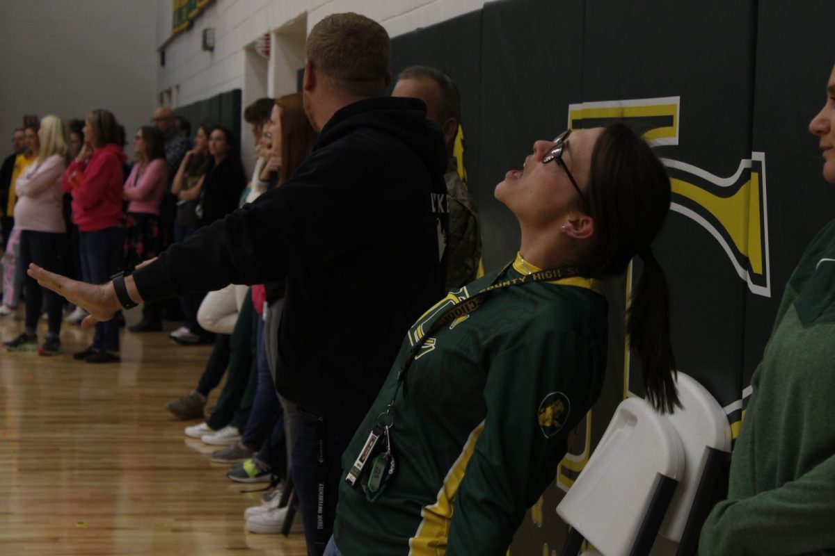 Special Education Teacher Virginia “Maria” Seay passionately sings along to a song played at the pep rally.