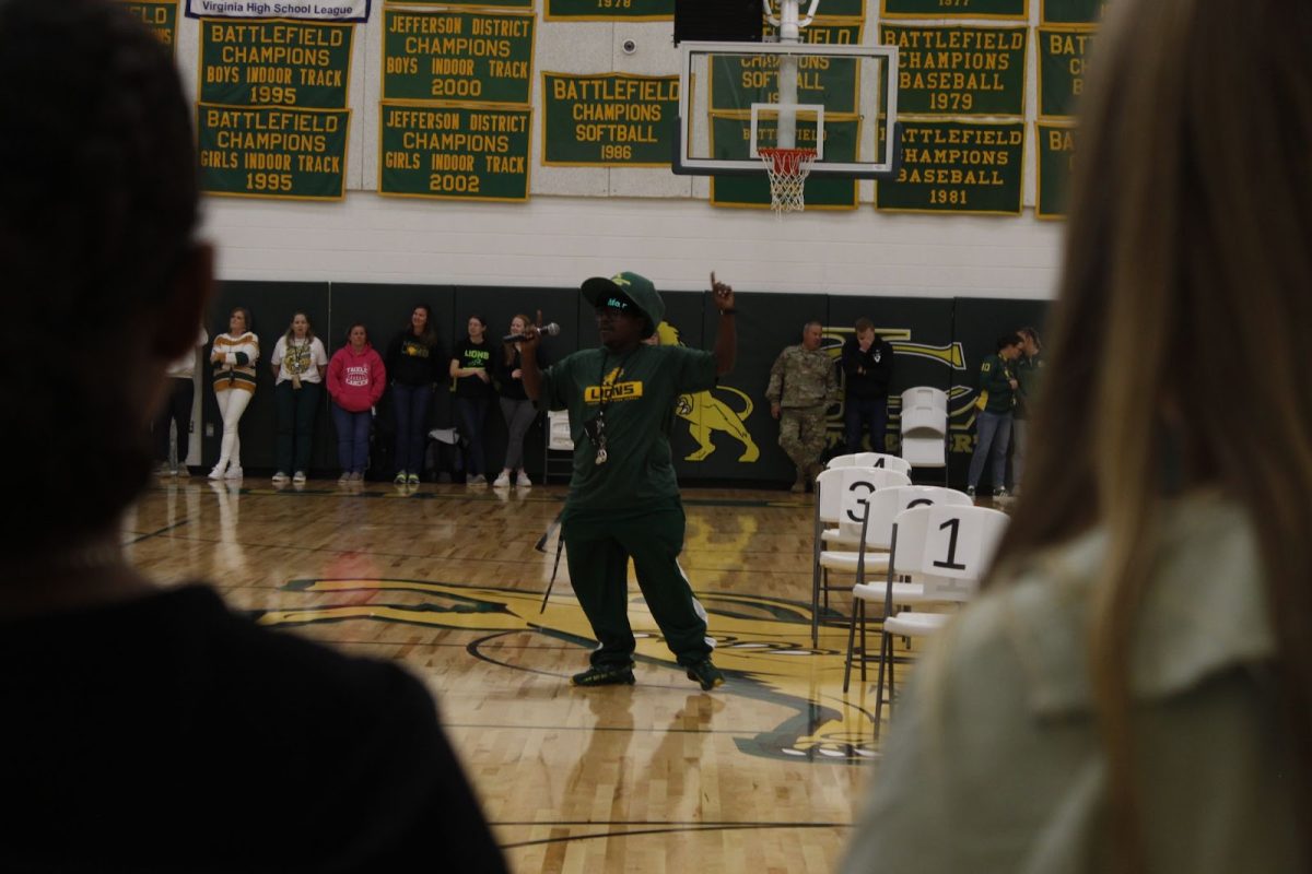 Micah Lee points upwards as he enthusiastically sings the “Glad” chant.
