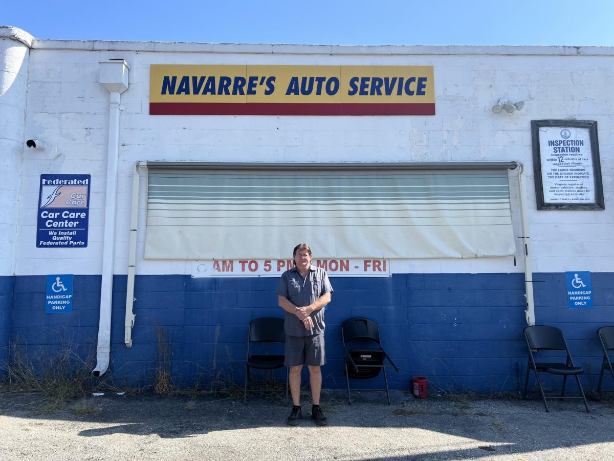 David Navarre in front of his shop "Navarre's Auto Service". 