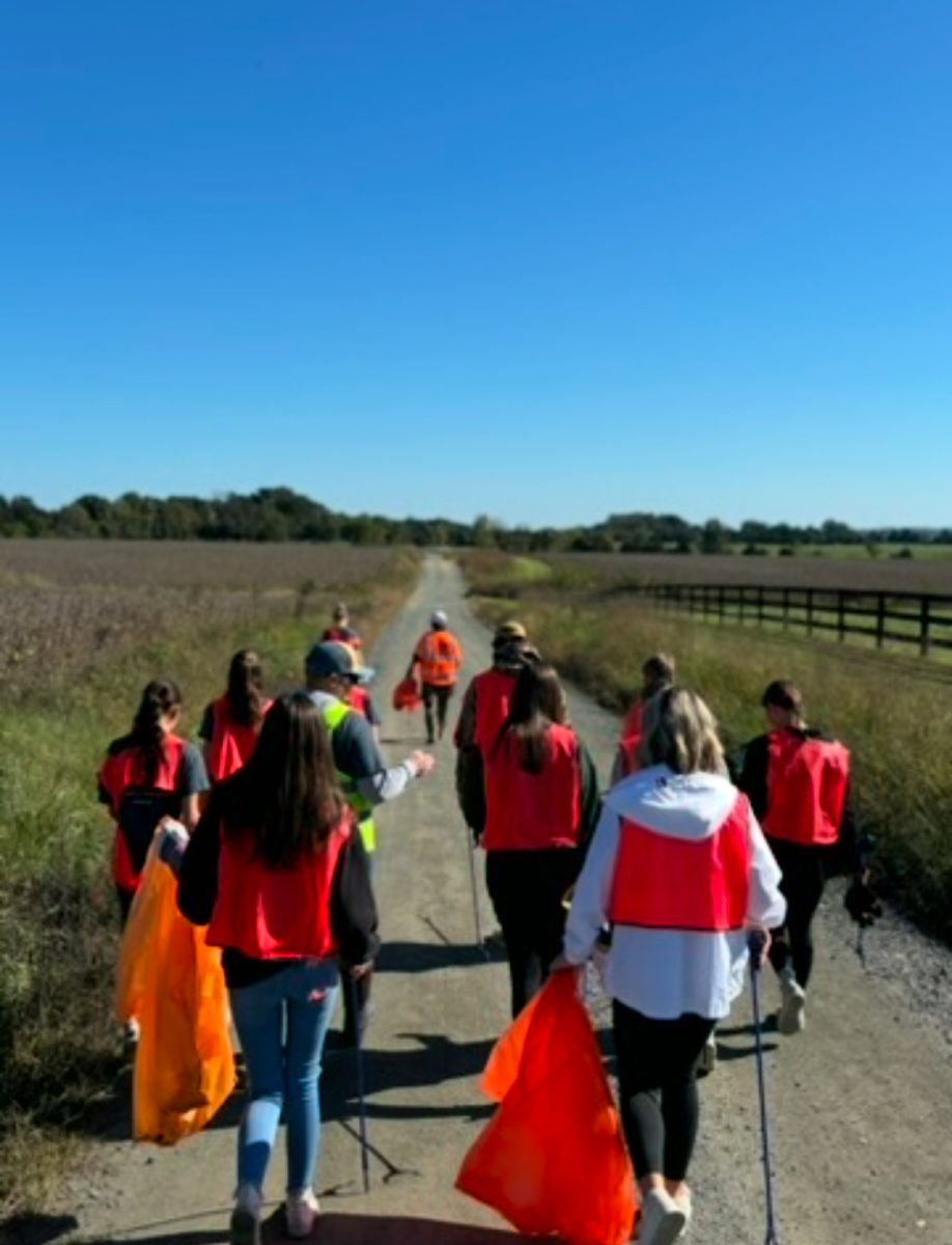 Louisa County hiking club walks through Green Springs looking for trash. 