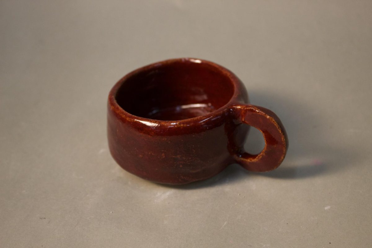 A red mug created by NAHS students that was sold for charity. 