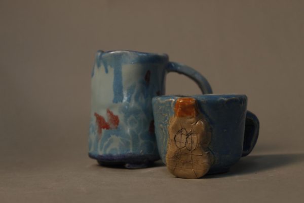 Two mugs created together to be sold for people who go without food. 