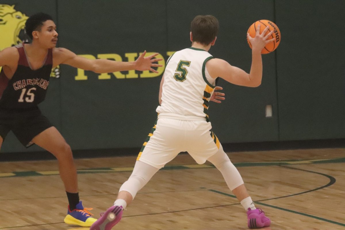 Junior Jonathan Jarvis angles himself to throw the ball around his defender to a fellow teammate.