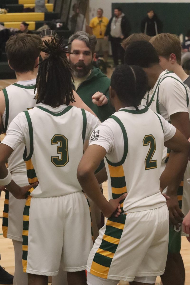 Gaurd Duo Johaun Ellis and Raesaun Ellis listen to Head Coach Roger Brooks during a timeout