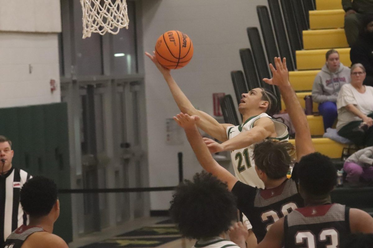 Brandon Bodden goes up for an acrobatic finish through the contact.