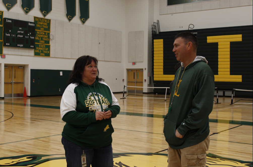 Softball coach Susan Sharpe (on the left) and baseball coach Kevin Fisher (on the right) discuss how they side with their view on gender inequality in sports.