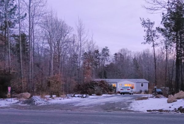  A driveway that is covered in ice and snow.