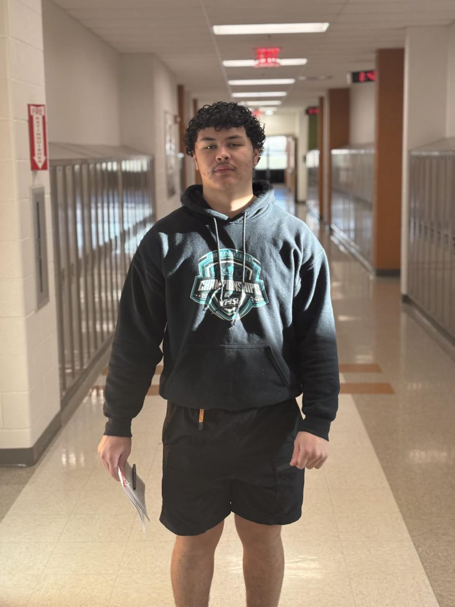 Junior thrower, Jayden Thompson standing in the hallway after being interviewed