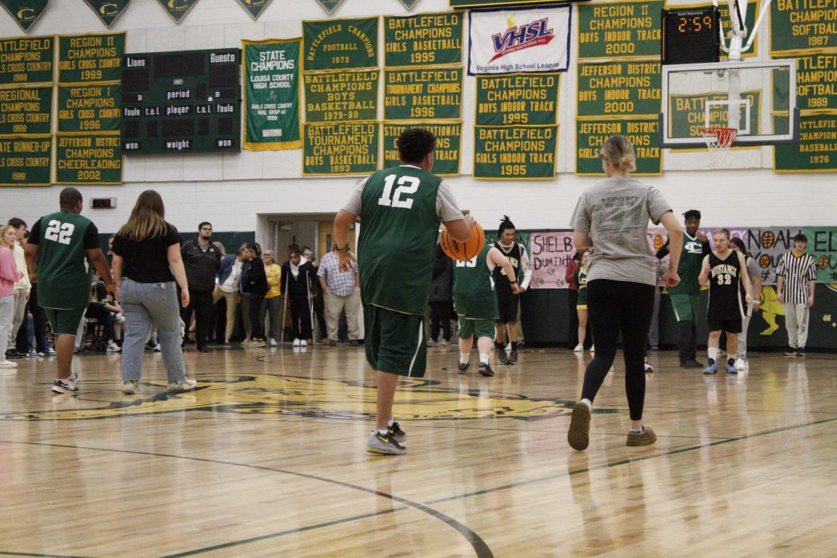 Louisa Switches to offense as they drive up the court.
