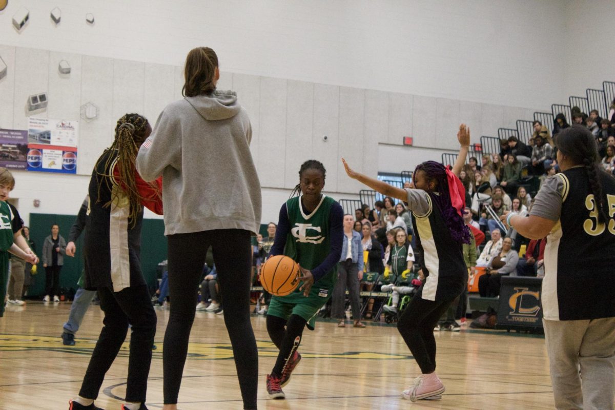 Louisa player Olajumoke "Jummy" Obe dribbles up the court against Monticello's defense.
