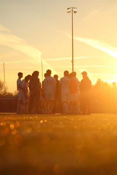 As the sun sets the Louisa Lions soccer team prepare to face Powhatan.