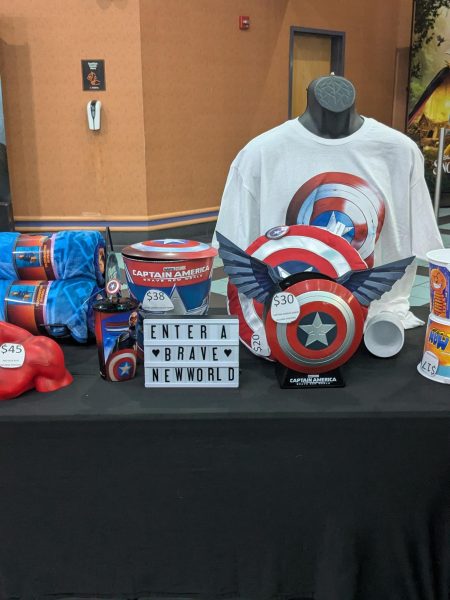 On the release night of “Captain America: Brave New World,” the Regal Cinema in Short Pump had a table decorated with Captain America merchandise. 
