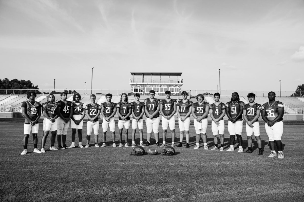 All of the senior football players lined up to take their last professional group photo before the 2025 season began. 