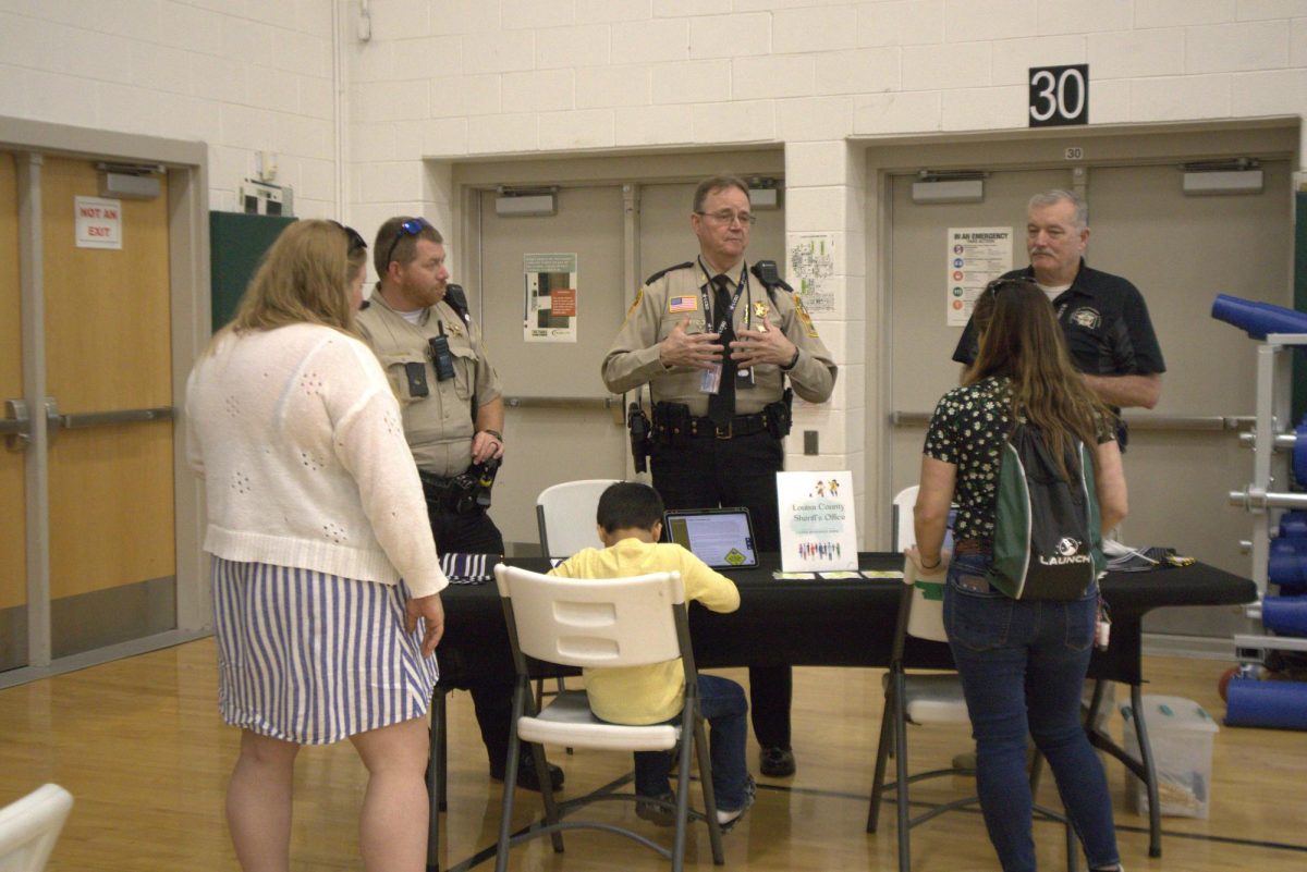 Local officers talk to families about the resources they offer and information on on programs they offer.