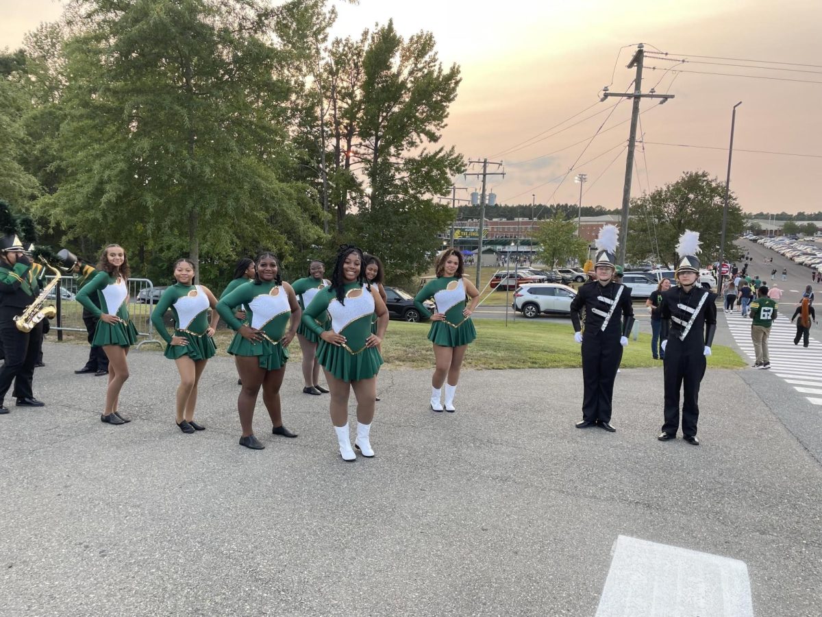 The Pride Elite Dance team and drum majors stand together before making their way down to the home football game. (Photo courtesy of Odessa Johnson).