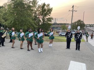 The Pride Elite Dance team and drum majors stand together before making their way down to the home football game. (Photo courtesy of Odessa Johnson).