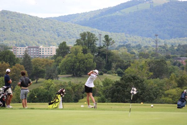 Sophomore Evan Snead is in his follow-through after hitting his drive at the driving range. 