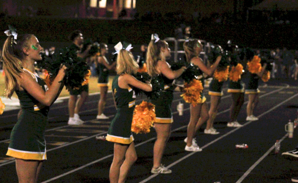 The cheer team performs “L-e-t-s g-o Let’s go” chant to motivate the football team to score another touchdown.