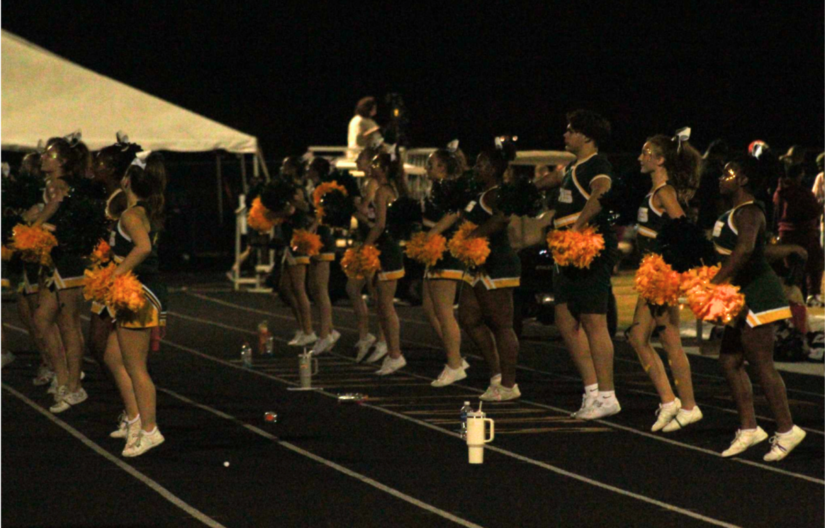 The team performs a dance to help rally the crowd and student section in the fourth quarter.