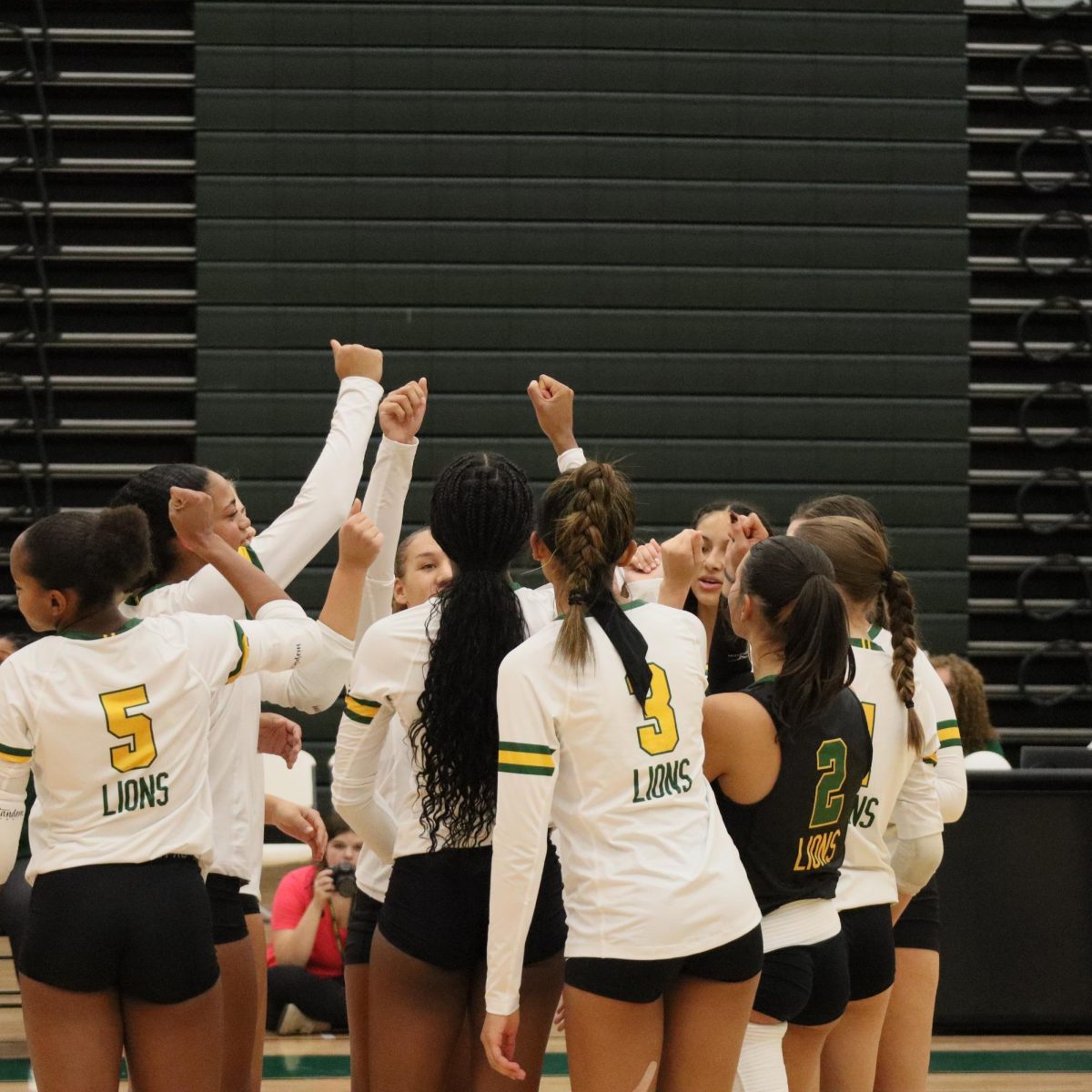 The team rallies together at the start of the game and prepares to play Eastern View.