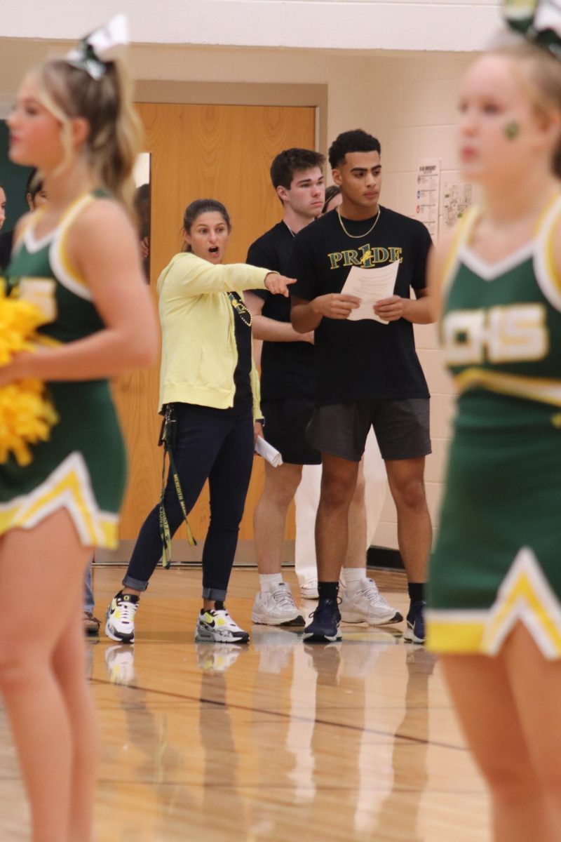 As the pep rally continues leadership teacher, Meredith Williamson, helps guide the leadership students to their positions.