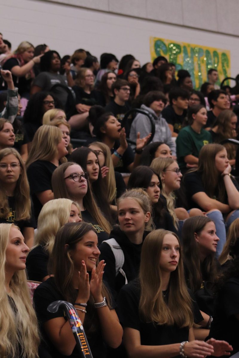 Before the pep rally begins, 
students filled the stands while the cheerleaders and band perform.