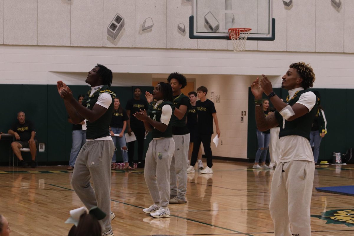 The football team dances and starts a “Go Fight” chant before their first home game of the season.