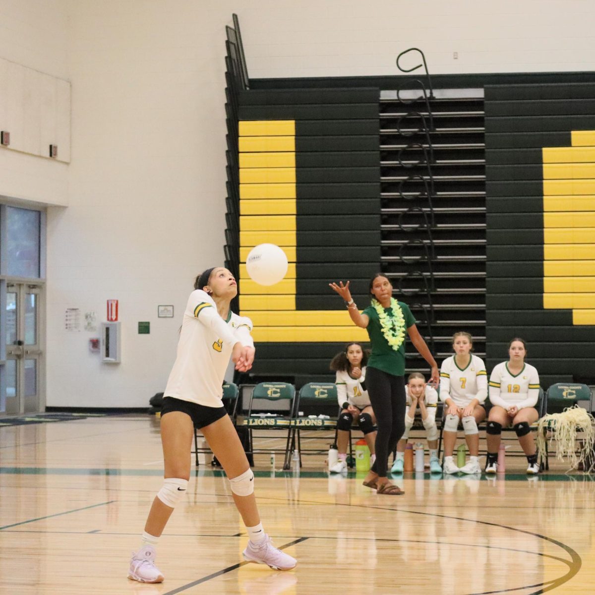Senior Kristen Martinez receives the opposing team’s serve during the second set.