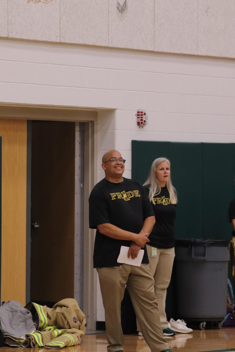 Principle Rodney Redd, smiles as he watches the games and the different grade levels compete against each other.
