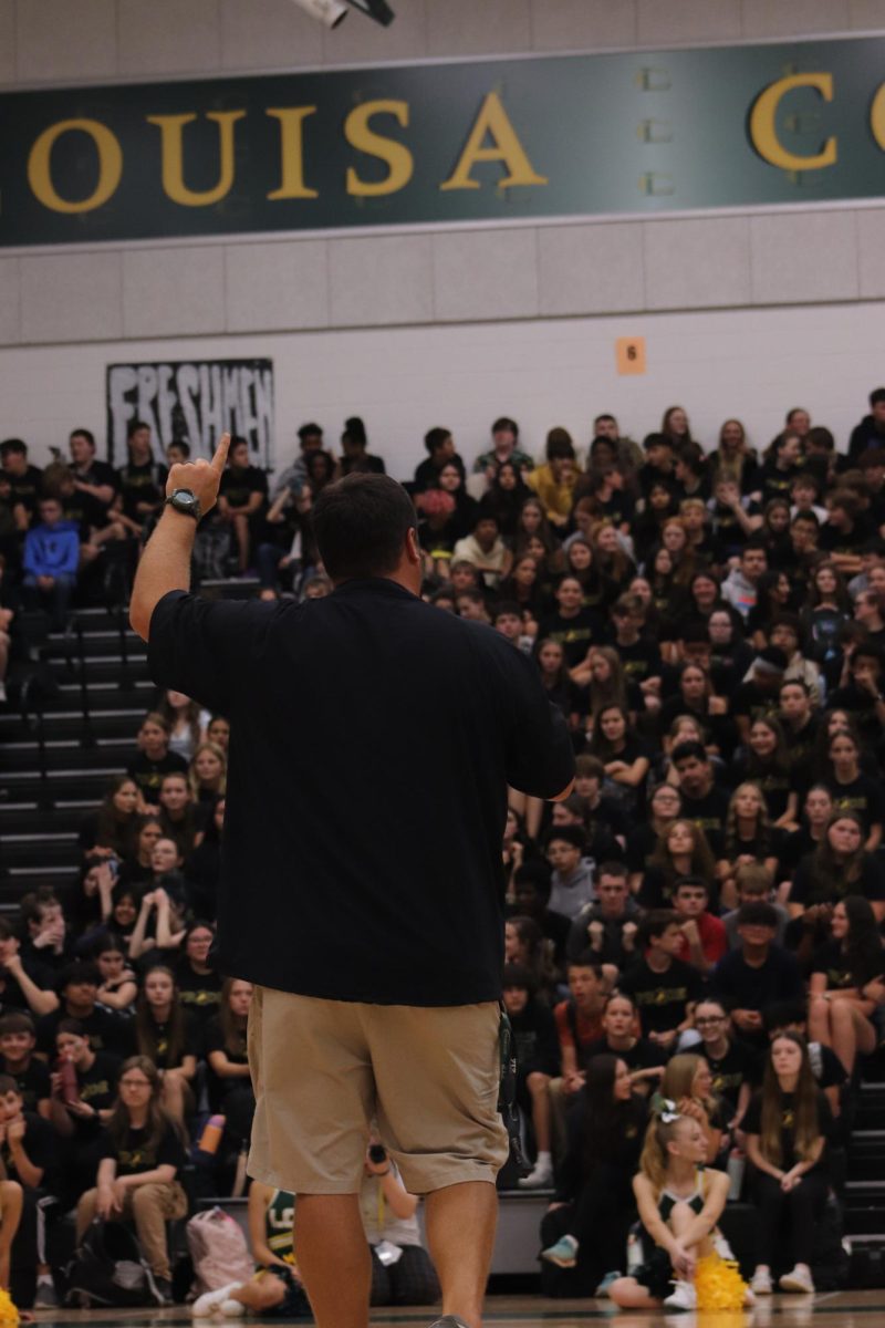 Coach William Patrick, rallies the school as he talks about the upcoming football game against Courtland.

